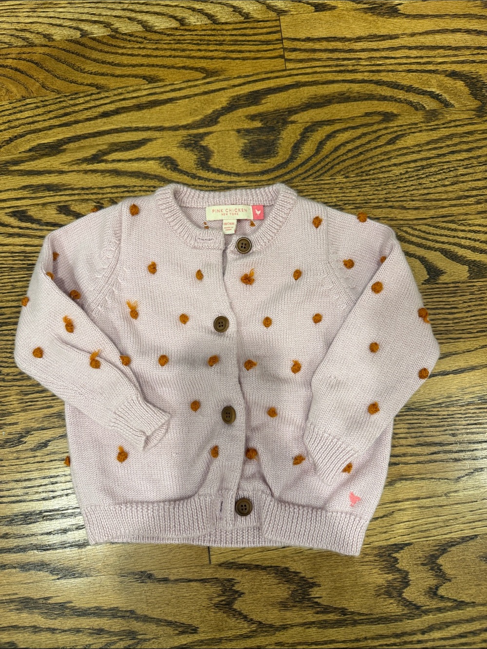 Pink Chicken Light Pink Cardigan with Orange Pom Dots